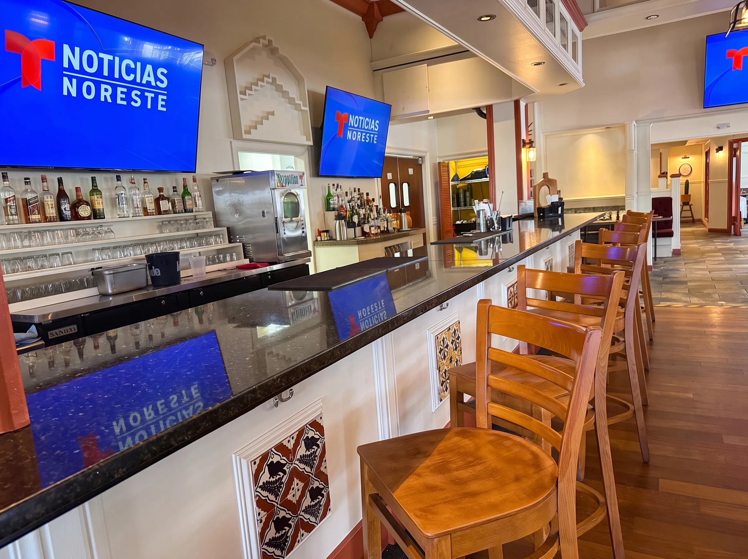 The cantina bar at Panfila with talavera tile front and a frozen margarita machine